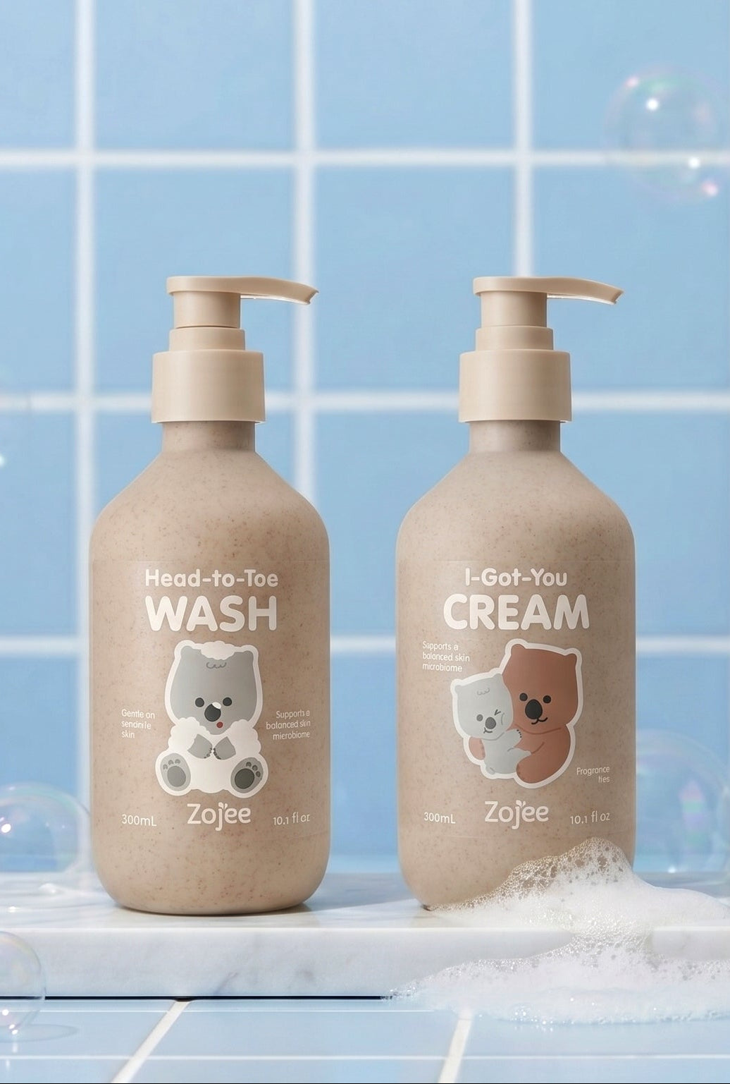 Head-to-Toe Wash and I-Got-You Cream bottles with wash droplets and a cream swirl