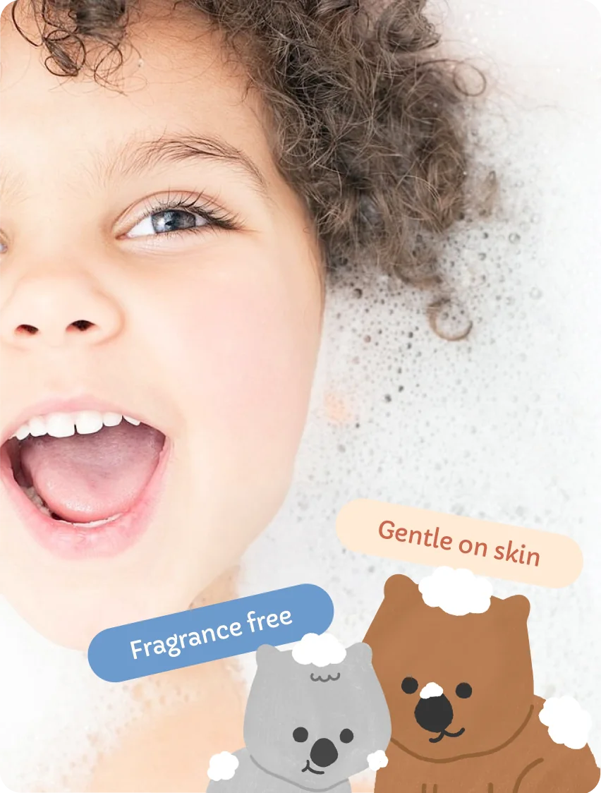 A laughing child covered in bubbles with Zojee mascots