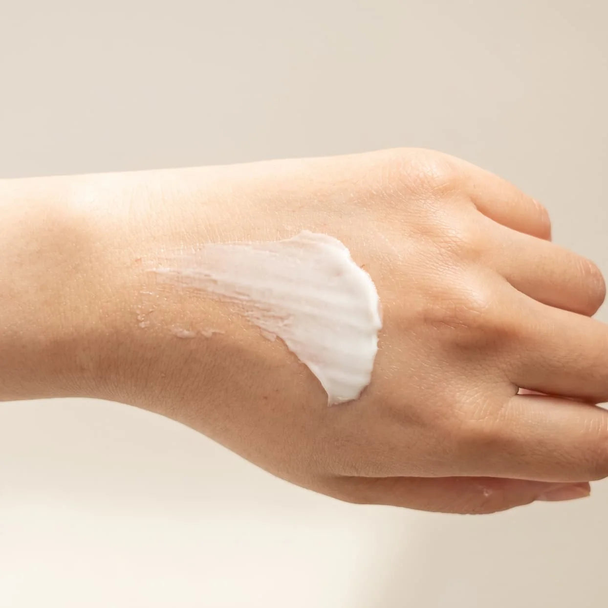 A smear of I-Got-You Cream on the back of a hand