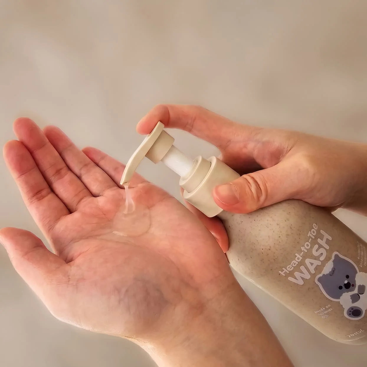 Head-to-Toe Wash being pumped into an open palm